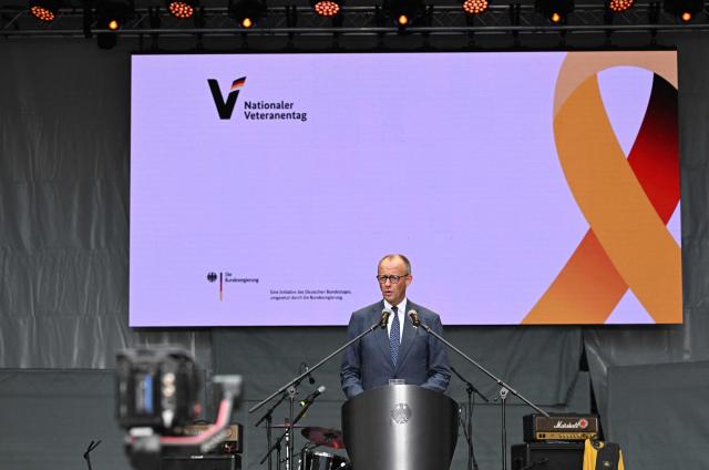 German Chancellor Friedrich Merz gives a speech during an event to mark the National Veterans' Day on June 21, 2026 in Berlin. The achievements of serving and former soldiers of the German armed forces (Bundeswehr) is honoured through events held across the country and a central celebration in Berlin. (Photo by RALF HIRSCHBERGER / AFP)