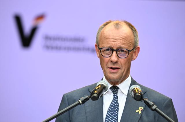 German Chancellor Friedrich Merz gives a speech during an event to mark the National Veterans' Day on June 21, 2026 in Berlin. The achievements of serving and former soldiers of the German armed forces (Bundeswehr) is honoured through events held across the country and a central celebration in Berlin. (Photo by RALF HIRSCHBERGER / AFP)