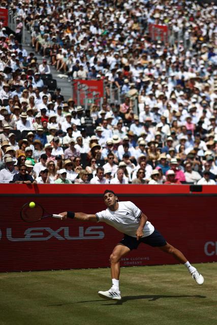 Argentina's Francisco Cerundolo returns to US player Tommy Paul during the men's singles final tennis match on day six of the ATP HSBC Championships at Queen's Club in west London on June 21, 2026. (Photo by Henry NICHOLLS / AFP)