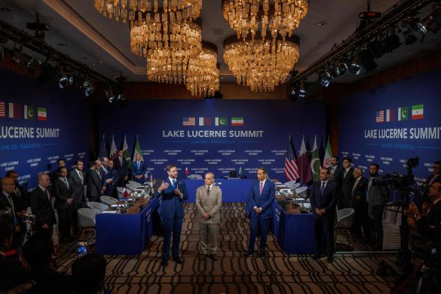 US Vice President JD Vance (L) speaks next to Pakistan's Prime Minister Shehbaz Sharif (C) and Qatar's Prime Minister Sheikh Mohammed bin Abdulrahman bin Jassim al-Thani prior to a quadrilateral meeting between the United States, Iran, Pakistan and Qatar at the Burgenstock luxury hotel complex overlooking Lake Lucerne, Switzerland, on June 21, 2026, as part of high-level talks aimed at advancing a deal to end the Middle East conflict. A new round of negotiations over the Middle East war was set to kick off on June 21, 2026 with Iranian negotiators arriving in the Swiss host city hours ahead of US Vice President JD Vance, even as Tehran said it was closing the Strait of Hormuz again over Israeli attacks in Lebanon. (Photo by URS FLUEELER / POOL / AFP)