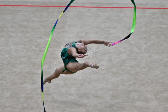 Uzbekistan's Natalya Usova competes in the individual ribbon of the 2026 Rhythmic Gymnastics World Challenge Cup in Beijing on June 21, 2026. (Photo by Pedro PARDO / AFP)