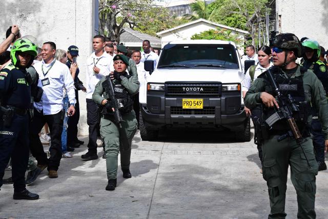 The car transporting Colombia's presidential candidate for the Defensores de la Patria movement, Abelardo de la Espriella, leaves a polling station during the presidential election runoff in Barranquilla, Colombia, on June 21, 2026. Colombians head to the polls to pick a new president between a hard-right White House-backed lawyer and a leftist senator that will decide the fate of the country's stumbling peace process and strained ties with Washington. (Photo by Jaime SALDARRIAGA / AFP)