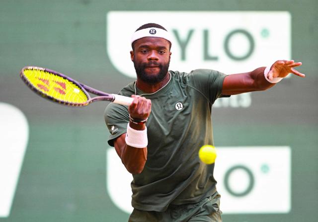 Frances Tiafoe of the US returns the ball to his compatriot Taylor Fritz during the men's singles final match of the Halle Open ATP tennis tournament in Halle, western Germany, on June 21, 2026. (Photo by CARMEN JASPERSEN / AFP)
