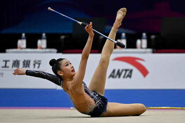South Korea's team competes in the three hoops and two sets of clubs routine final of the 2026 Rhythmic Gymnastics World Challenge Cup in Beijing on June 21, 2026. (Photo by Pedro PARDO / AFP)