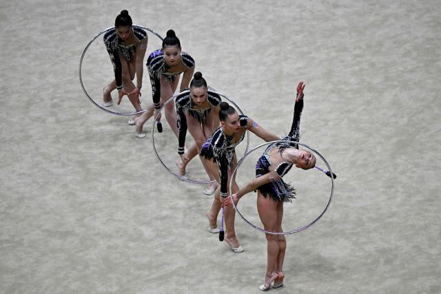 USA's team competes in the three hoops and two sets of clubs routine final of the 2026 Rhythmic Gymnastics World Challenge Cup in Beijing on June 21, 2026. (Photo by Pedro PARDO / AFP)