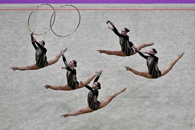 Russia's team competes in the three hoops and two sets of clubs routine final of the 2026 Rhythmic Gymnastics World Challenge Cup in Beijing on June 21, 2026. (Photo by Pedro PARDO / AFP)