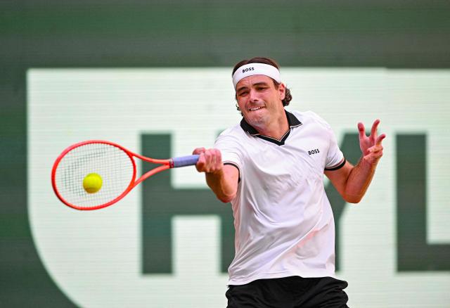 Taylor Fritz of the US returns the ball to his compatriot Frances Tiafoe during their men's singles final match of the Halle Open ATP tennis tournament in Halle, western Germany, on June 21, 2026. (Photo by CARMEN JASPERSEN / AFP)