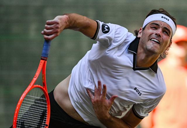 Taylor Fritz of the US plays the ball to his compatriot Frances Tiafoe during their men's singles final match of the Halle Open ATP tennis tournament in Halle, western Germany, on June 21, 2026. (Photo by CARMEN JASPERSEN / AFP)
