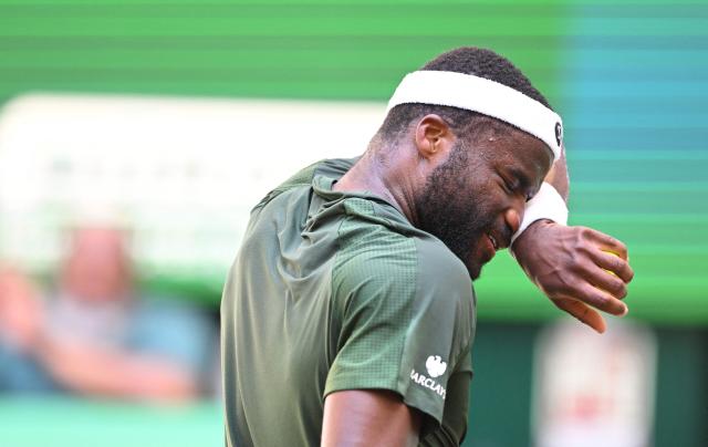Frances Tiafoe of the US reacts during his men's singles final match of the Halle Open ATP tennis tournament against his compatriot Taylor Fritz, in Halle, western Germany, on June 21, 2026. (Photo by CARMEN JASPERSEN / AFP)