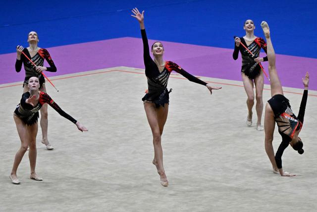 Belarus's team competes in the three hoops and two sets of clubs routine final of the 2026 Rhythmic Gymnastics World Challenge Cup in Beijing on June 21, 2026. (Photo by Pedro PARDO / AFP)