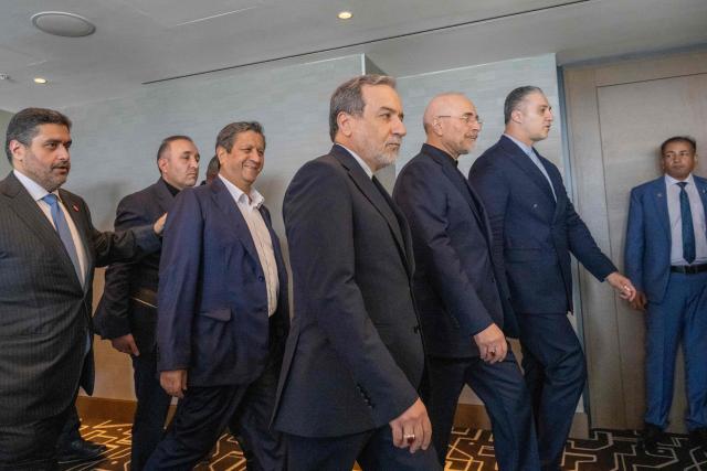 Iran's delegation including Minister of Foreign Affairs of Iran Abbas Araghchi (C) and Speaker of the Islamic Parliament of Iran, Mohammed Bagher Ghalibaf (3rdR) arrive for a quadrilateral meeting between the United States, Iran, Pakistan and Qatar at the Burgenstock luxury hotel complex near Lake Lucerne, Switzerland, on June 21, 2026, as part of talks aimed at advancing a deal to end the Middle East conflict. A new round of negotiations over the Middle East war was set to kick off on June 21, 2026 with Iranian negotiators arriving in the Swiss host city hours ahead of US Vice President JD Vance, even as Tehran said it was closing the Strait of Hormuz again over Israeli attacks in Lebanon. (Photo by URS FLUEELER / POOL / AFP)