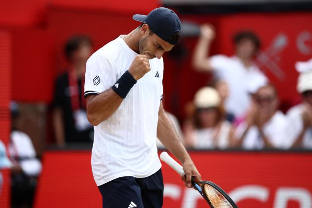 Argentina's Francisco Cerundolo reacts after winning the second set against US player Tommy Paul during the men's singles final tennis match on day six of the ATP HSBC Championships at Queen's Club in west London on June 21, 2026. (Photo by Henry Nicholls / AFP)