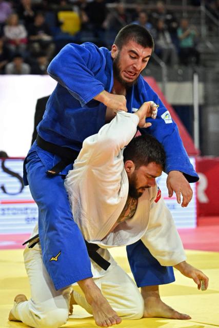 Idar Bifov (L) of Russia and Gennaro Pirelli of Italy compete in men’s under 100kg category final event at the Judo Ulaanbaatar Grand Slam 2026 in Ulaanbaatar on June 21, 2026. (Photo by ADEK BERRY / AFP)