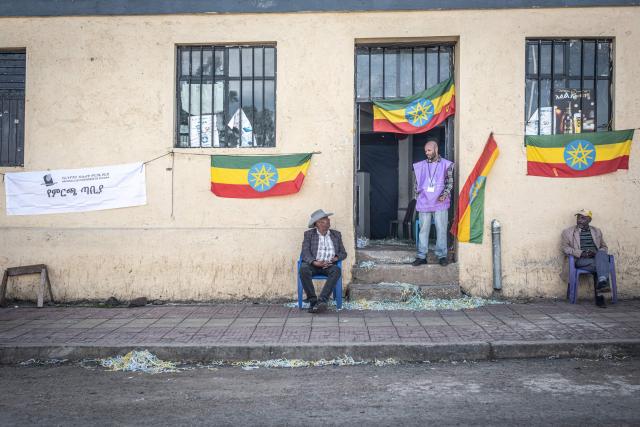 (FILES) A National Election Board of Ethiopia (NEBE) official stands at the entrance of a polling station in Kechene, Addis Ababa, on June 1, 2026 during the 2026 Ethiopian parliamentary elections. Ethiopian Prime Minister Abiy Ahmed's Prosperity Party (PP) won a landslide victory in legislative polls held June 1, the election commission said Sunday, giving it almost 90 percent of the seats.
Abiy has led Ethiopia since 2018, and is increasingly criticised for growing authoritarianism, in contrast to his early years when he won the Nobel Peace Prize for mending relations with neighbouring Eritrea.
The PP was considered the overwhelming favourite in the country of 130 million, facing a divided opposition that did not field candidates in many constituencies. (Photo by Marco Simoncelli / AFP)