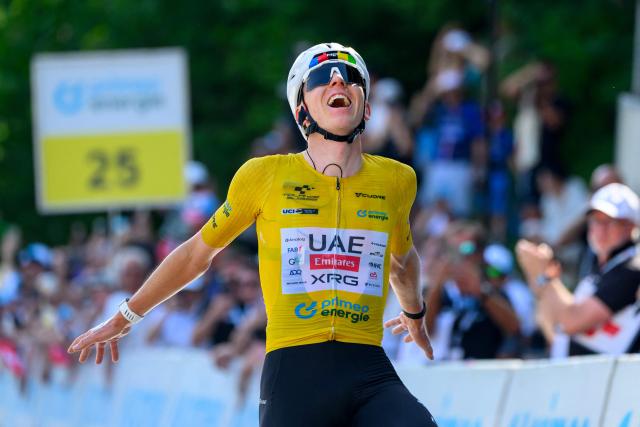 UAE Team Emirates - XRG team's Slovenian rider Tadej Pogacar celebrates as he crosses the finish line to win the fith and final stage of the Men's Tour of Switzerland (Tour de Suisse) cycling race, 150.7 km starting and finishing in Villars-sur-Ollon on June 21, 2026. (Photo by Harold Cunningham / AFP)