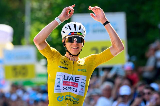 UAE Team Emirates - XRG team's Slovenian rider Tadej Pogacar celebrates as he crosses the finish line to win the fith and final stage of the Men's Tour of Switzerland (Tour de Suisse) cycling race, 150.7 km starting and finishing in Villars-sur-Ollon on June 21, 2026. (Photo by Harold Cunningham / AFP)