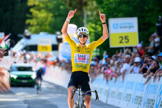 UAE Team Emirates - XRG team's Slovenian rider Tadej Pogacar celebrates as he crosses the finish line to win the fith and final stage of the Men's Tour of Switzerland (Tour de Suisse) cycling race, 150.7 km starting and finishing in Villars-sur-Ollon on June 21, 2026. (Photo by Harold Cunningham / AFP)