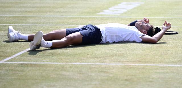 Argentina's Francisco Cerundolo reacts after winning against US player Tommy Paul during the men's singles final tennis match on day six of the ATP HSBC Championships at Queen's Club in west London on June 21, 2026. (Photo by Henry NICHOLLS / AFP)