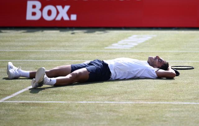 Argentina's Francisco Cerundolo reacts after winning against US player Tommy Paul during the men's singles final tennis match on day six of the ATP HSBC Championships at Queen's Club in west London on June 21, 2026. (Photo by Henry NICHOLLS / AFP)