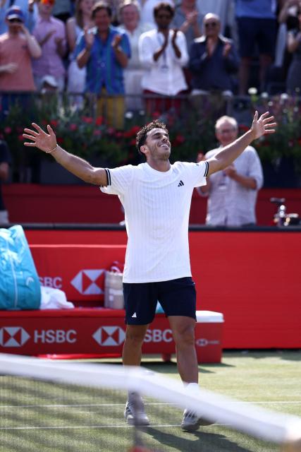 Argentina's Francisco Cerundolo reacts after winning against US player Tommy Paul during the men's singles final tennis match on day six of the ATP HSBC Championships at Queen's Club in west London on June 21, 2026. (Photo by Henry NICHOLLS / AFP)