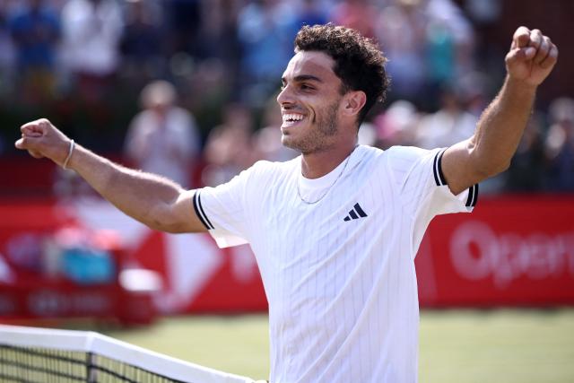 Argentina's Francisco Cerundolo reacts after winning against US player Tommy Paul during the men's singles final tennis match on day six of the ATP HSBC Championships at Queen's Club in west London on June 21, 2026. (Photo by Henry NICHOLLS / AFP)