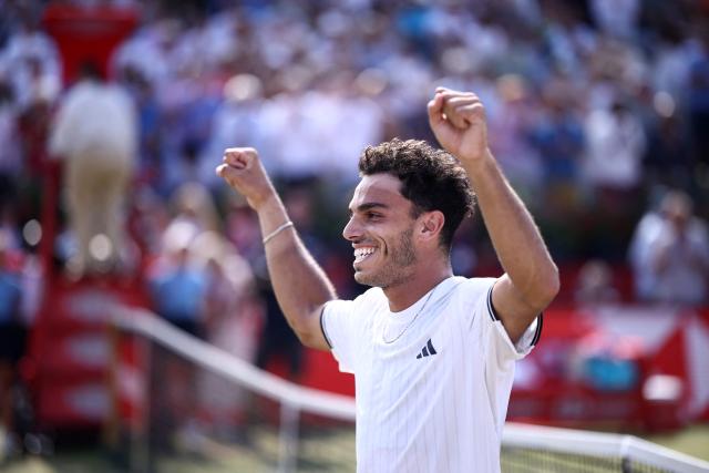 Argentina's Francisco Cerundolo reacts after winning against US player Tommy Paul during the men's singles final tennis match on day six of the ATP HSBC Championships at Queen's Club in west London on June 21, 2026. (Photo by Henry NICHOLLS / AFP)