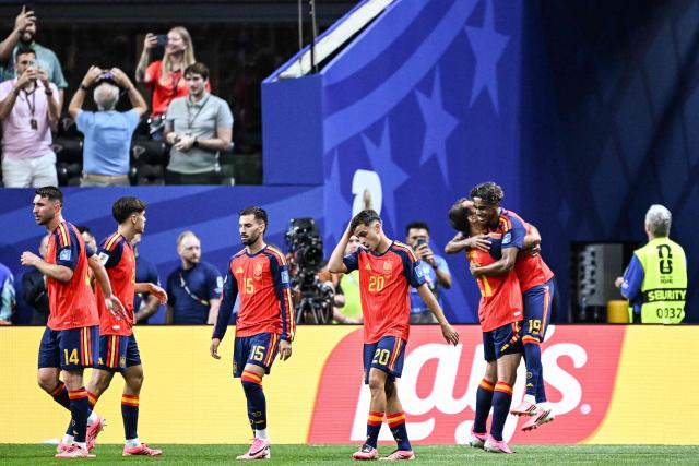 Spain's forward #19 Lamine Yamal (R) celebrates with teammates after scoring the opening goal during the 2026 World Cup Group H football match between Spain and Saudi Arabia at the Atlanta Stadium in Atlanta on June 21, 2026.  (Photo by ROBERTO SCHMIDT / AFP)