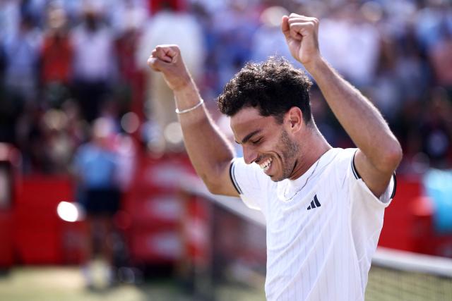 Argentina's Francisco Cerundolo reacts after winning against US player Tommy Paul during the men's singles final tennis match on day six of the ATP HSBC Championships at Queen's Club in west London on June 21, 2026. (Photo by Henry NICHOLLS / AFP)