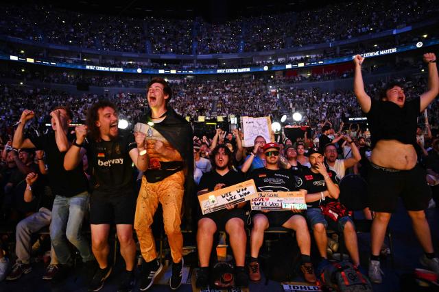 Supporters of the Team Falcons celebrate during the grand final between FURIA Esports und Team Falcons of the IEM Cologne Major 2026 Counter Strike tournament at the Lanxess Arena in Cologne, western Germany on June 21, 2026. (Photo by Ina FASSBENDER / AFP)