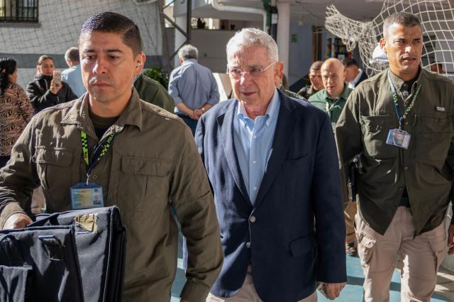 Colombia's former president (2002-2010) Alvaro Uribe arrives to vote at a polling station during the presidential election runoff in Rionegro, Antioquia department, Colombia, on June 21, 2026. Colombians head to the polls to pick a new president between a hard-right White House-backed lawyer and a leftist senator that will decide the fate of the country's stumbling peace process and strained ties with Washington. (Photo by Juan CARDONA / AFP)