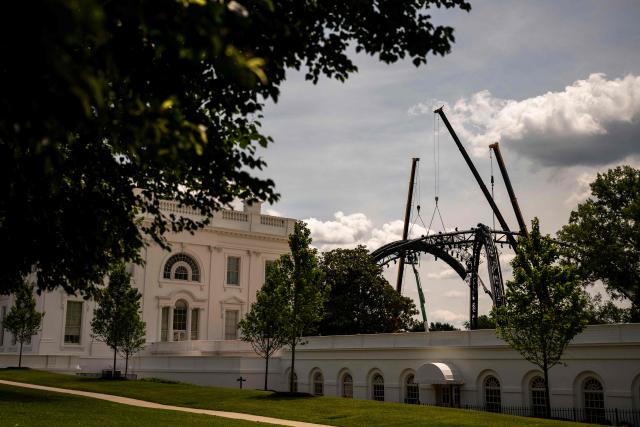Workers disassemble The Claw from the UFC Freedom 250 fight on the South Lawn of the White House, in Washington, DC on June 21, 2026. (Photo by Kent Nishimura / AFP)