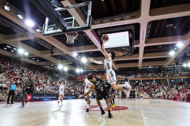 Paris Basketball's French-Algerian guard #02 Nadir Hifi (R) attempts a shot during the French Ligue Nationale de Basket (LNB Elite) Pro A final match between AS Monaco Basket and Paris Basketball, at the Gaston Medecin arena in Monaco on June 21, 2026. (Photo by Valery HACHE / AFP)