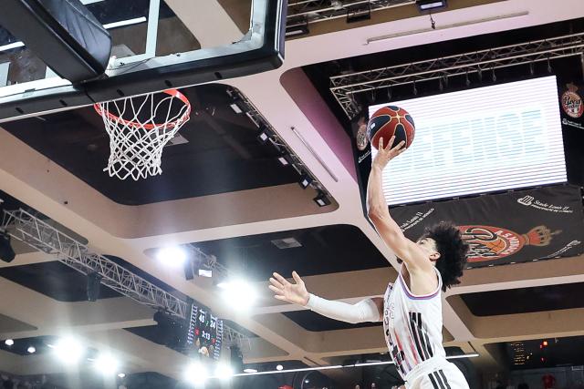 Paris Basketball's French-Algerian guard #02 Nadir Hifi attempts a shot during the French Ligue Nationale de Basket (LNB Elite) Pro A final match between AS Monaco Basket and Paris Basketball, at the Gaston Medecin arena in Monaco on June 21, 2026. (Photo by Valery HACHE / AFP)
