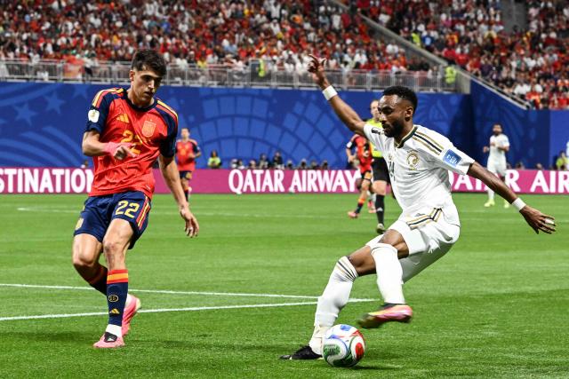 Saudi Arabia's defender #24 Moteb Al-Harbi (R) fights for the ball with Spain's defender #22 Pau Cubarsi  during the 2026 World Cup Group H football match between Spain and Saudi Arabia at the Atlanta Stadium in Atlanta on June 21, 2026.  (Photo by ROBERTO SCHMIDT / AFP)