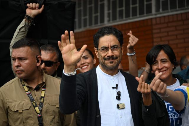 Colombia's presidential candidate for the ruling Pacto Historico party, Ivan Cepeda, waves after voting at a polling station during the presidential election runoff, in Bogota on June 21, 2026. Colombians head to the polls to pick a new president between a hard-right White House-backed lawyer and a leftist senator that will decide the fate of the country's stumbling peace process and strained ties with Washington. (Photo by Raul ARBOLEDA / AFP)