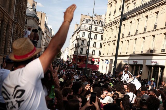 A musician plays the drum during the annual street music festival 'Fete de la Musique' at Place de la République in Paris on June 21, 2026. (Photo by Guillaume BAPTISTE / AFP)
