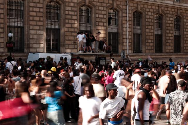 Partygoers gather during the annual street music festival 'Fete de la Musique' at Place de la République in Paris on June 21, 2026. (Photo by Guillaume BAPTISTE / AFP)