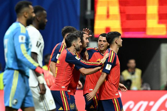 Spain's defender #24 Marc Cucurella (C) celebrates with teammates after scoring his team's fourth goal during the 2026 World Cup Group H football match between Spain and Saudi Arabia at the Atlanta Stadium in Atlanta on June 21, 2026.  (Photo by ROBERTO SCHMIDT / AFP)