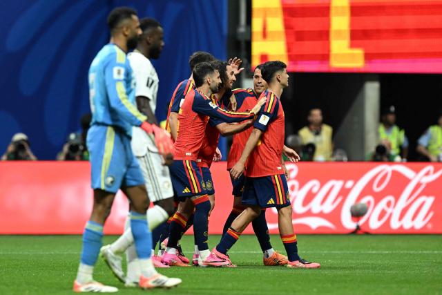 Spain's defender #24 Marc Cucurella (C) celebrates with teammates after scoring his team's fourth goal  during the 2026 World Cup Group H football match between Spain and Saudi Arabia at the Atlanta Stadium in Atlanta on June 21, 2026.  (Photo by ROBERTO SCHMIDT / AFP)
