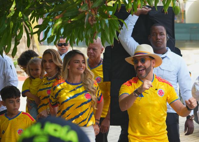 Colombia's presidential candidate for the Defensores de la Patria movement, Abelardo de la Espriella, gestures next to his wife Ana Lucia Pineda at a polling station during the presidential election runoff in Barranquilla, Colombia, on June 21, 2026. Colombians head to the polls to pick a new president between a hard-right White House-backed lawyer and a leftist senator that will decide the fate of the country's stumbling peace process and strained ties with Washington. (Photo by Vanexa Romero / AFP)