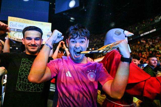 Supporters of the Team Falcons celebrate during the grand final between FURIA Esports und Team Falcons of the IEM Cologne Major 2026 Counter Strike tournament at the Lanxess Arena in Cologne, western Germany on June 21, 2026. (Photo by Ina FASSBENDER / AFP)