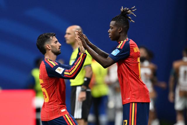 Spain's midfielder #15 Alex Baena (L) is substituted by Spain's forward #17 Nico Williams  during the 2026 World Cup Group H football match between Spain and Saudi Arabia at the Atlanta Stadium in Atlanta on June 21, 2026.  (Photo by ROBERTO SCHMIDT / AFP)