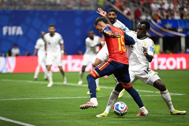 Saudi Arabia's defender #12 Saud Abdulhamid (R) fights for the ball with Spain's midfielder #15 Alex Baena  during the 2026 World Cup Group H football match between Spain and Saudi Arabia at the Atlanta Stadium in Atlanta on June 21, 2026.  (Photo by ROBERTO SCHMIDT / AFP)