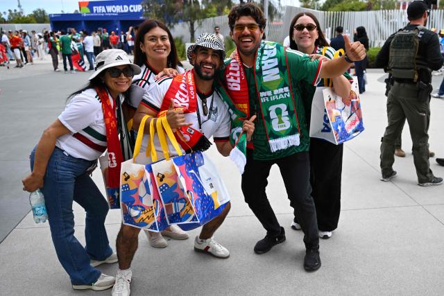 Mexican fans pose for a picture ahead of the 2026 World Cup Group G football match between Belgium and Iran at the Los Angeles Stadium in Inglewood on June 21, 2026.  (Photo by Patrick T. Fallon / AFP)