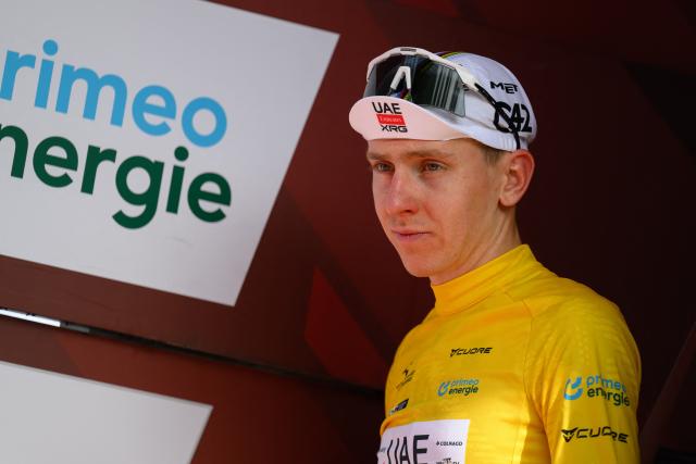UAE Team Emirates-XRG's Slovenian rider Tadej Pogacar arrives on the podium after winning the Men's Tour of Switzerland (Tour de Suisse) cycling race, in Villars-sur-Ollon on June 21, 2026. (Photo by Harold Cunningham / AFP)