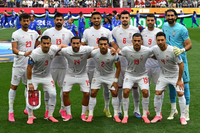 Iran's players pose for a picture ahead of the 2026 World Cup Group G football match between Belgium and Iran at the Los Angeles Stadium in Inglewood on June 21, 2026.  (Photo by Patrick T. Fallon / AFP)