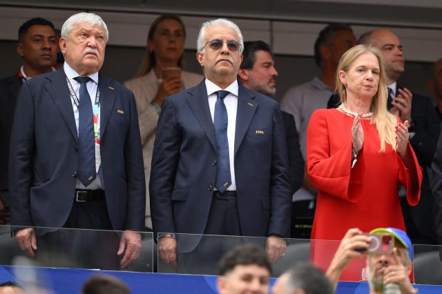 President of the Hungarian Football Federation and Vice President of FIFA and UEFA Sandor Csanyi (L) President of the Asian Football Confederation Salman bin Ibrahim Al Khalifa (C) and Head the Royal Belgian Football Association Pascale Van Damme are seen ahead of the 2026 World Cup Group G football match between Belgium and Iran at the Los Angeles Stadium in Inglewood on June 21, 2026.  (Photo by Patrick T. Fallon / AFP)