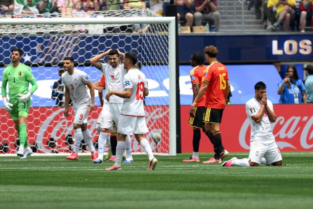 Iran's defender #13 Hossein Kanani reacts to a missed chance during the 2026 World Cup Group G football match between Belgium and Iran at the Los Angeles Stadium in Inglewood on June 21, 2026.  (Photo by Patrick T. Fallon / AFP)