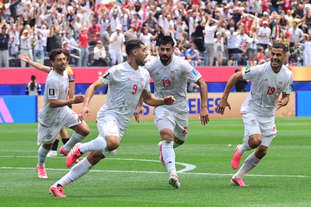 Iran's forward #09 Mehdi Taremi celebrates a goal which was later disallowed after a VAR review during the 2026 World Cup Group G football match between Belgium and Iran at the Los Angeles Stadium in Inglewood on June 21, 2026.  (Photo by Frederic J. Brown / AFP)