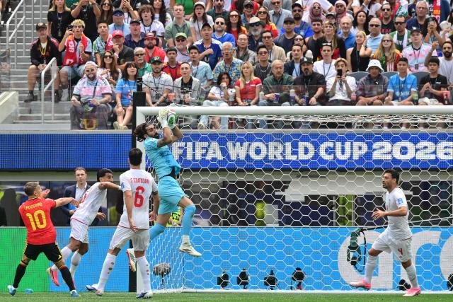 Iran's goalkeeper #01 Alireza Beiranvand makes a save during the 2026 World Cup Group G football match between Belgium and Iran at the Los Angeles Stadium in Inglewood on June 21, 2026.  (Photo by Frederic J. Brown / AFP)